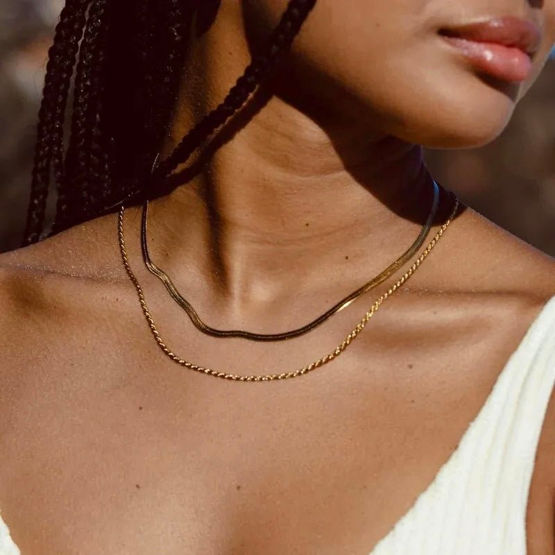 Close-up of 2-in-1 gold layered necklace worn by a woman with blonde hair