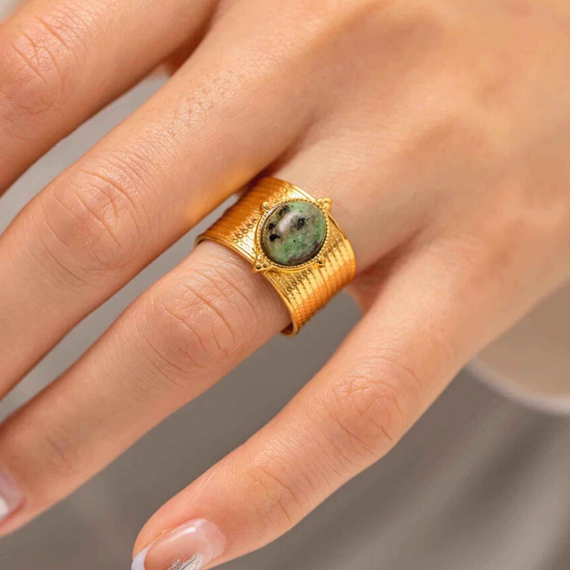 Statement adjustable gold rings with natural gemstones stacked on fingers