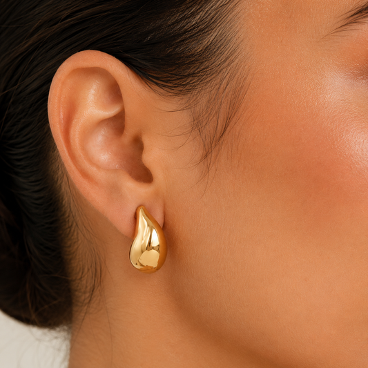 Gold teardrop stud earrings worn on ear, chunky gold earrings in waterproof 18K gold plated stainless steel