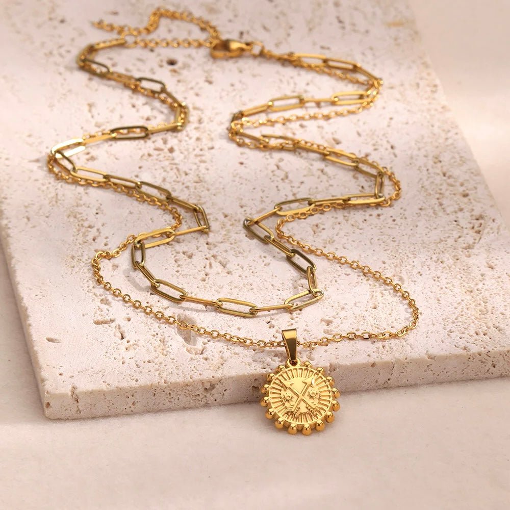 Double-chain necklace set featuring a radiant gold sun medallion