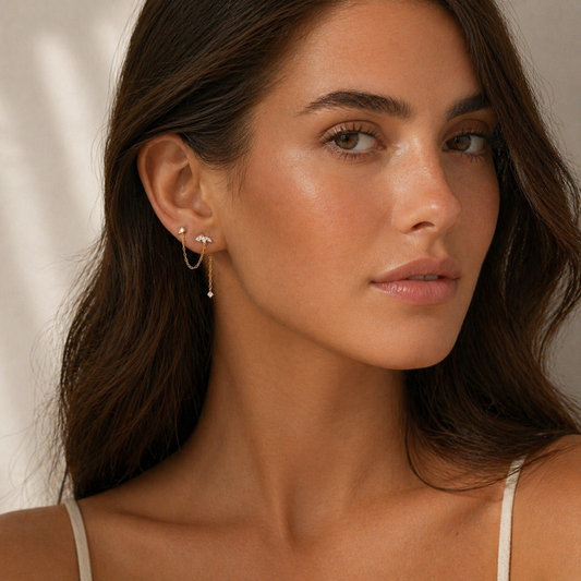 double piercing chain stud earrings worn on model minimal ear stack look