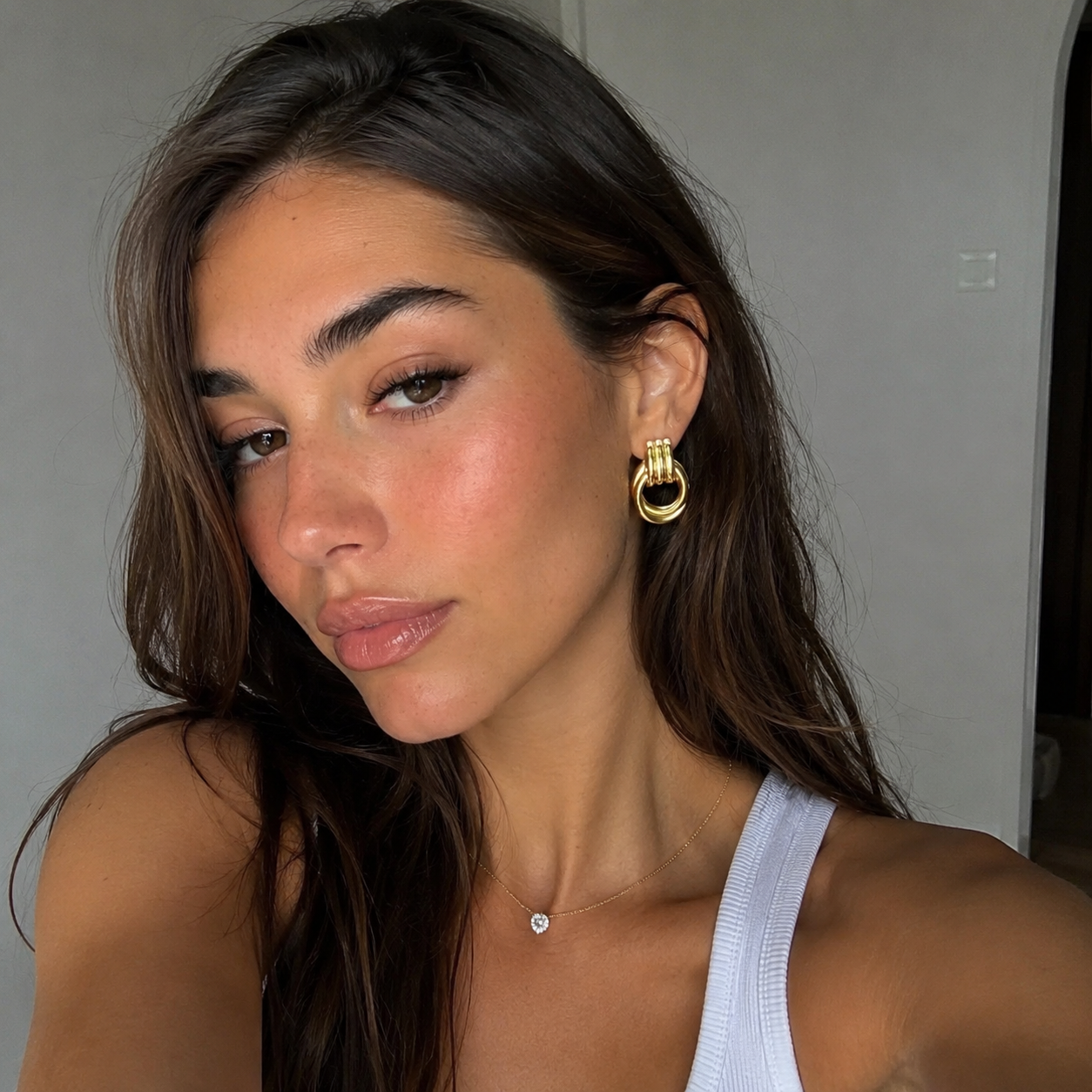 Eleonor chunky gold earrings styled for an everyday look