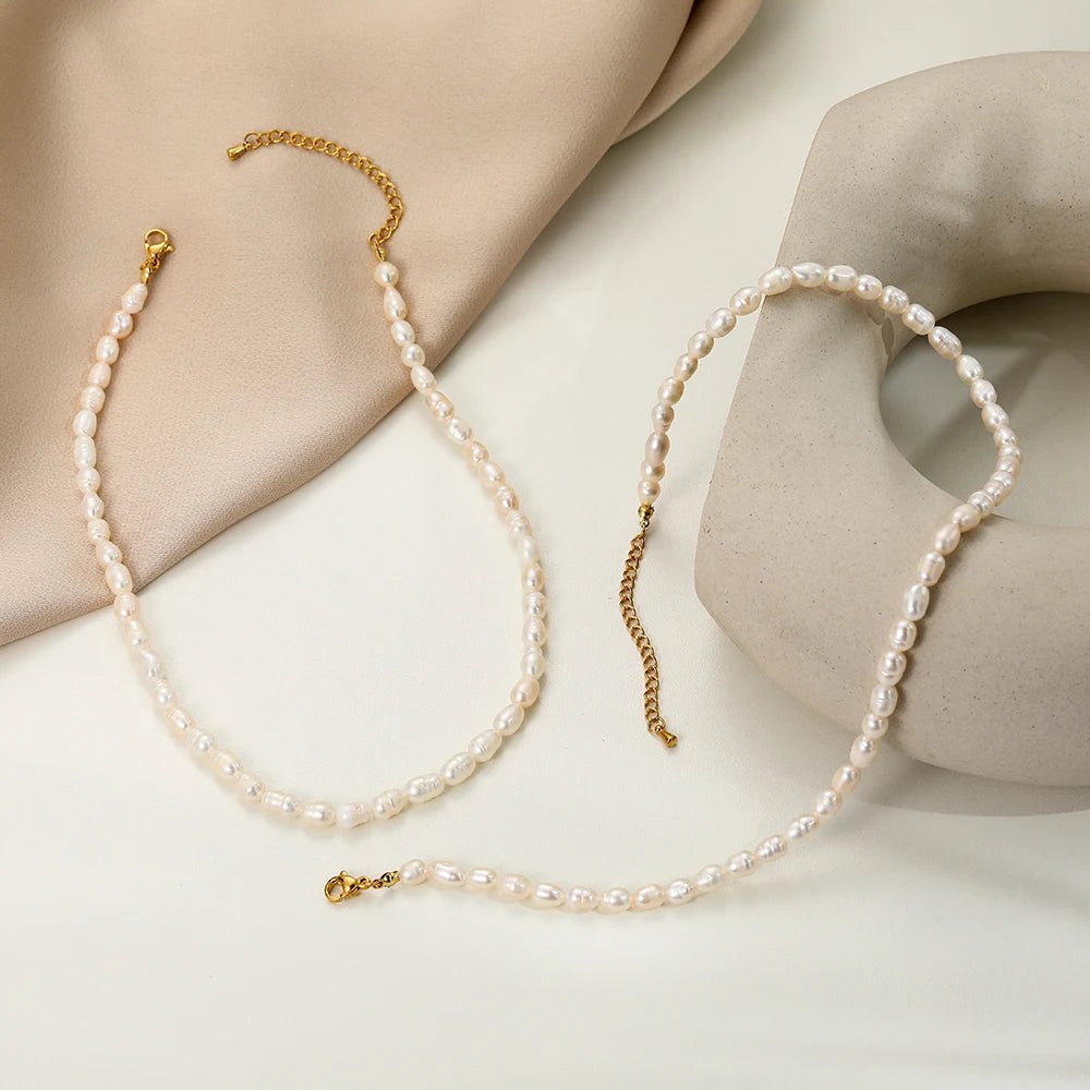 Freshwater Pearl Choker displayed in a soft curve on a beige fabric background.
