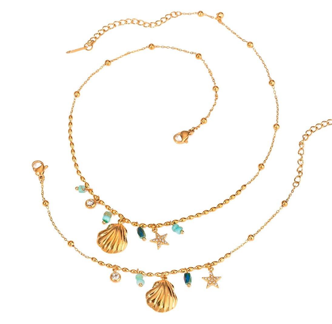 Matching gold shell charm necklace and bracelet set with turquoise beads and starfish pendant on white background