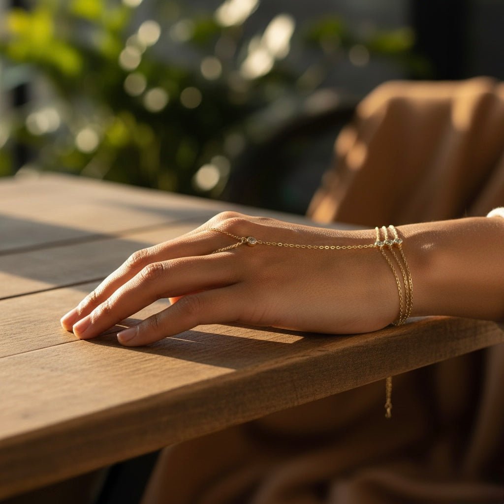 Gold Trio Hand Chain Bracelet photographed outdoors, shimmering in sunlight with delicate chains and zircon accents.