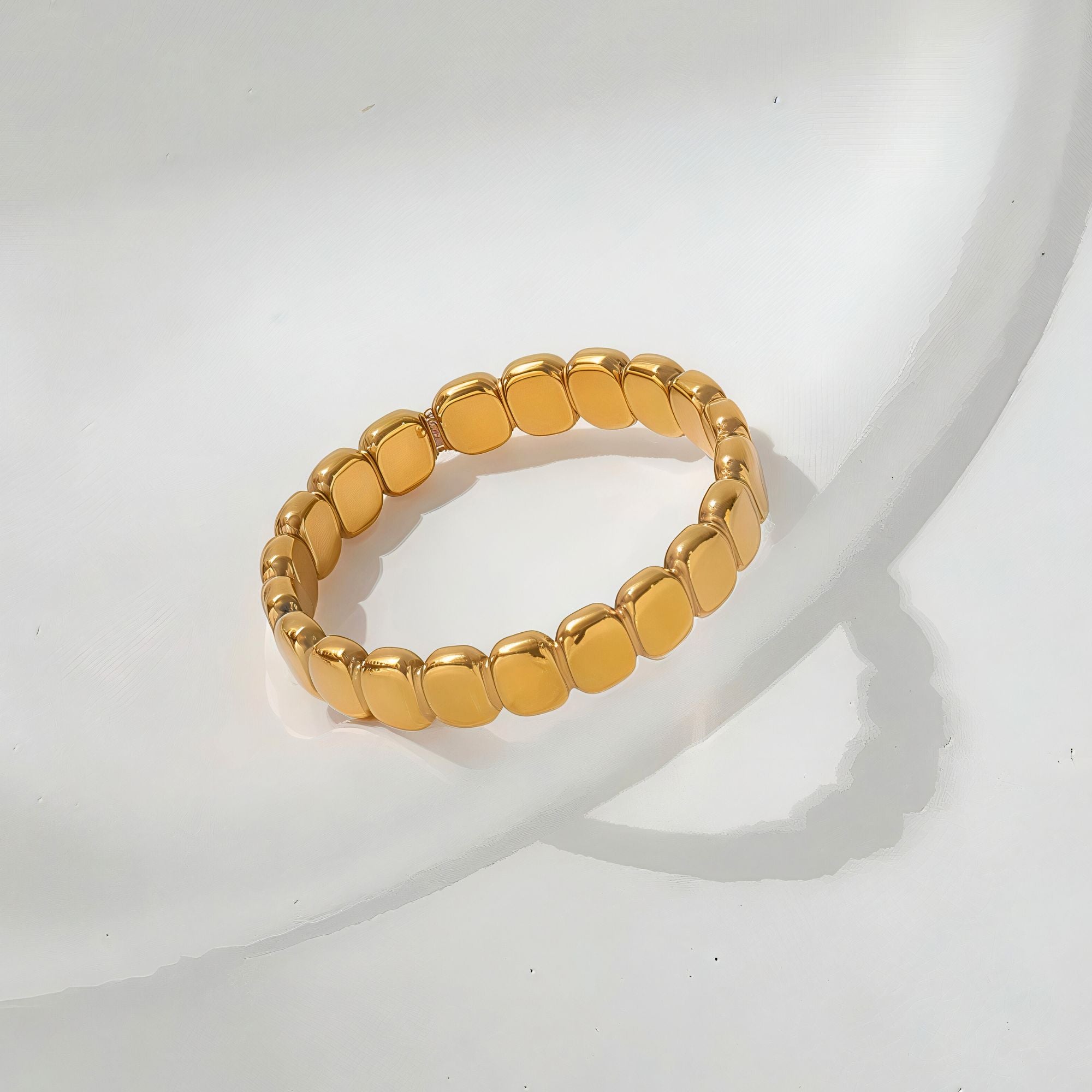 Close-up of waterproof gold-plated beaded ring with polished finish and square bead details.