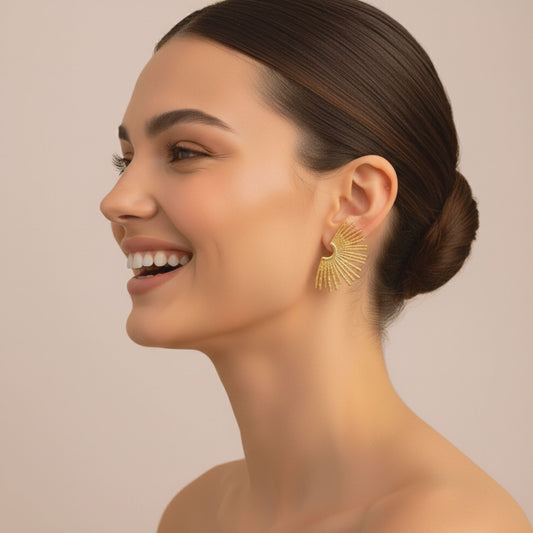 Model wearing Golden Halo Earrings with sunburst hammered design in 18K gold