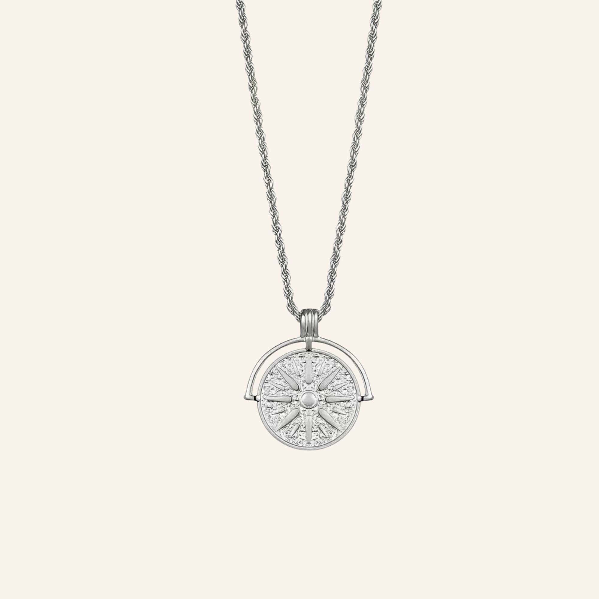 Helia Necklace silver version with radiant sun medallion pendant.