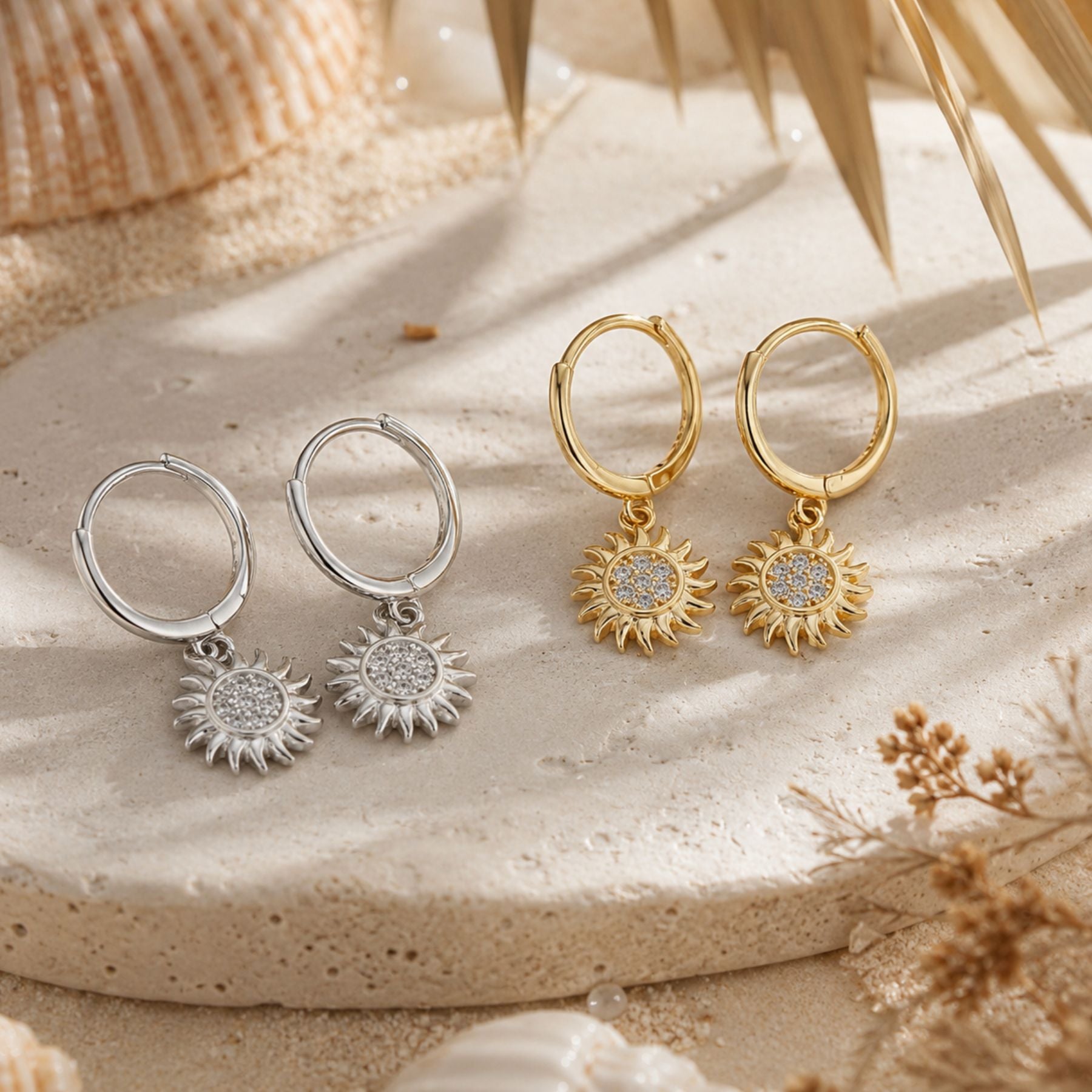 Helio sun hoop earrings in gold and silver with sparkling zirconia charms