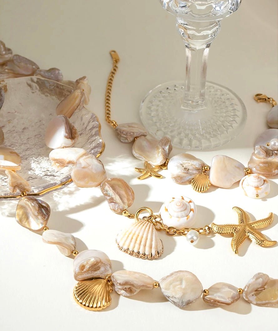 Gold-plated jewelry set with irregular pearls and marine charms – necklace and bracelet