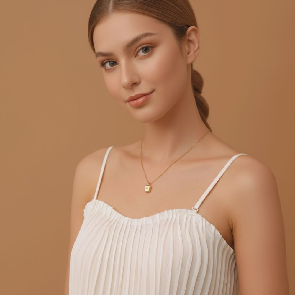 Elegant look with mini star pendant necklace, worn by a woman, dainty gold minimalist jewelry