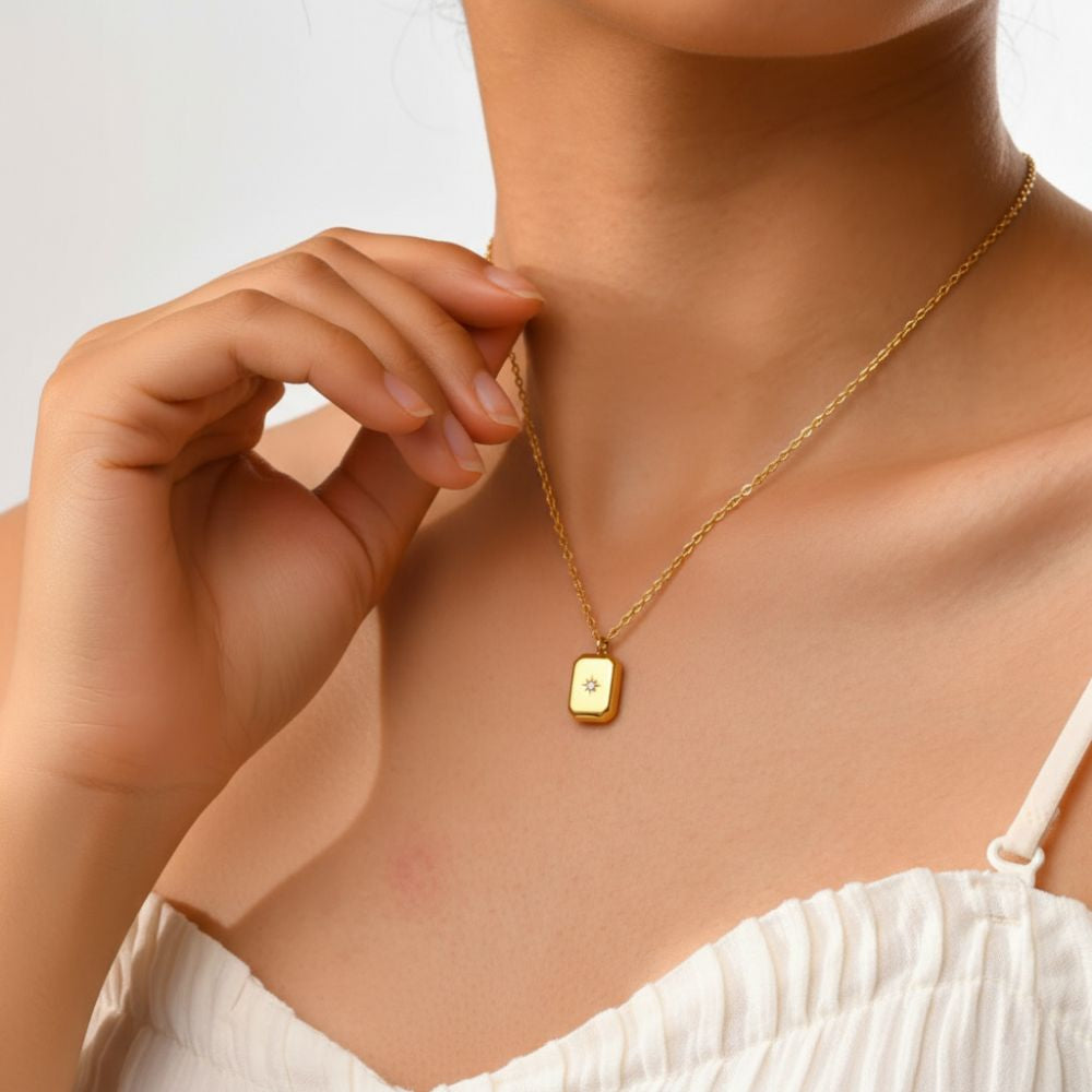 Lifestyle photo of mini star pendant necklace, minimalist gold jewelry for everyday wear