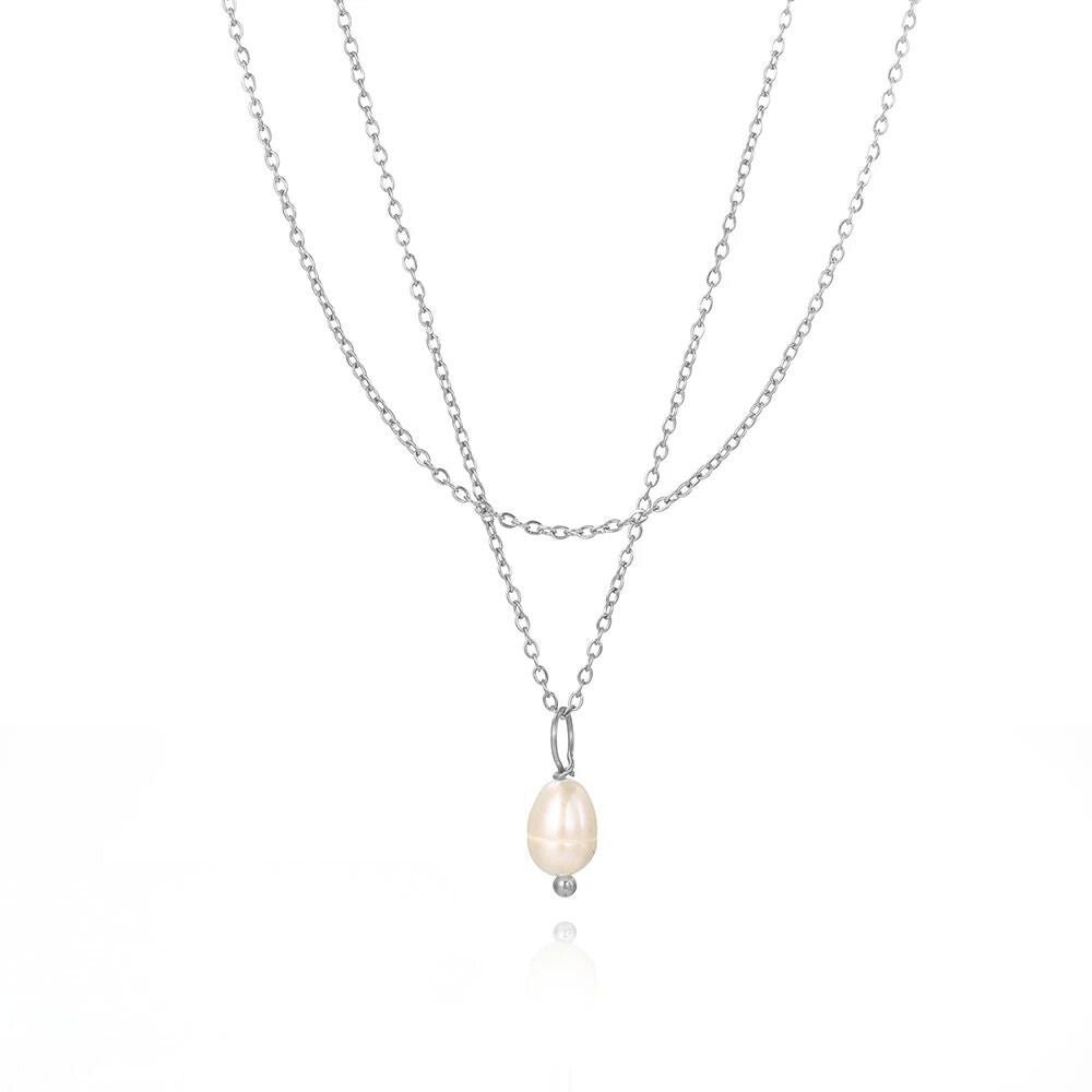 Silver layered necklace featuring a dainty natural freshwater pearl pendant.