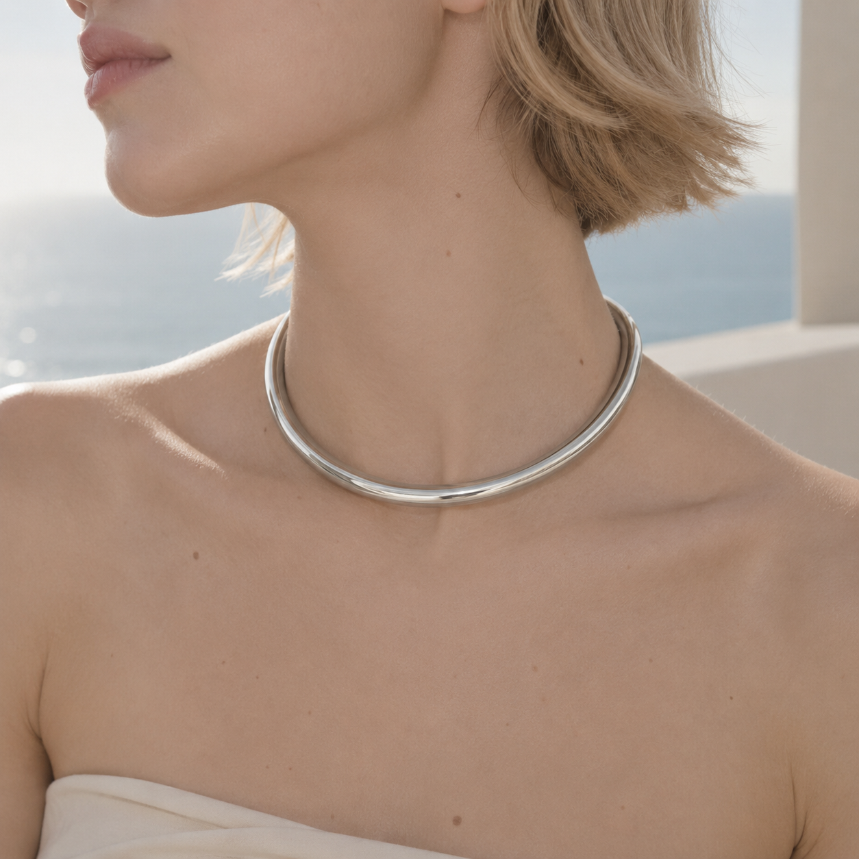 Minimalist silver collar necklace worn by model