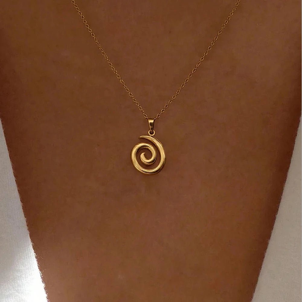 Minimalist gold spiral necklace worn close-up – 18K gold plated waterproof pendant