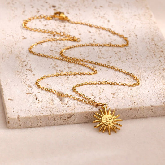 Gold sun pendant necklace with smiling face on fine chain