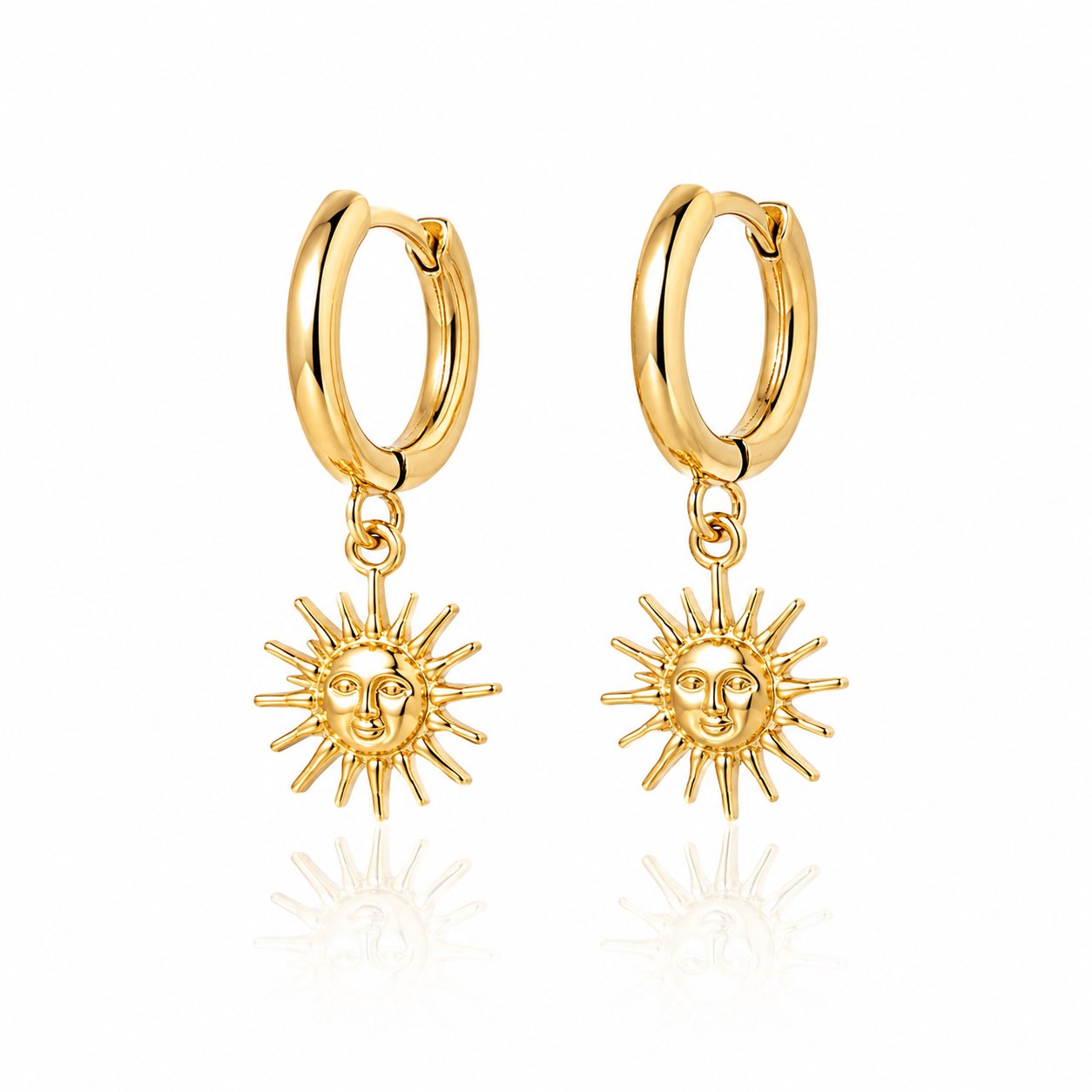 Pair of 18K gold plated sun hoop earrings with celestial charm on white background