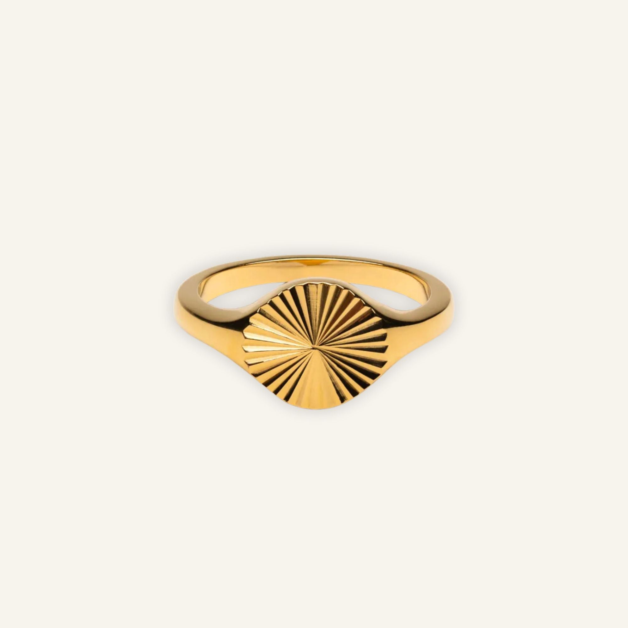 Gold signet ring with engraved sunburst design, waterproof and tarnish-free statement jewelry