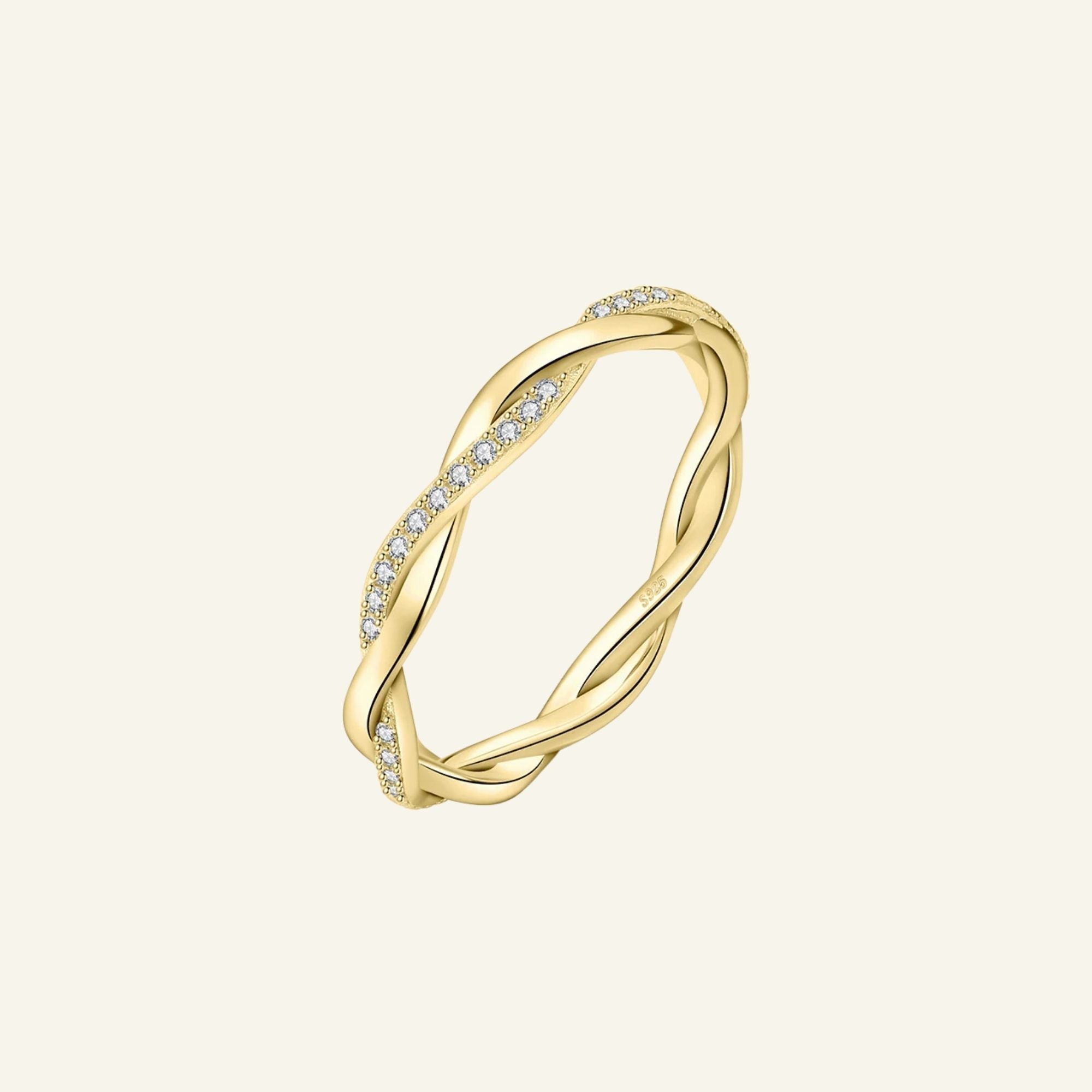 Gold Twist Ring on hand – delicate 18K gold-plated twisted band with moissanite stones, waterproof and tarnish-free.