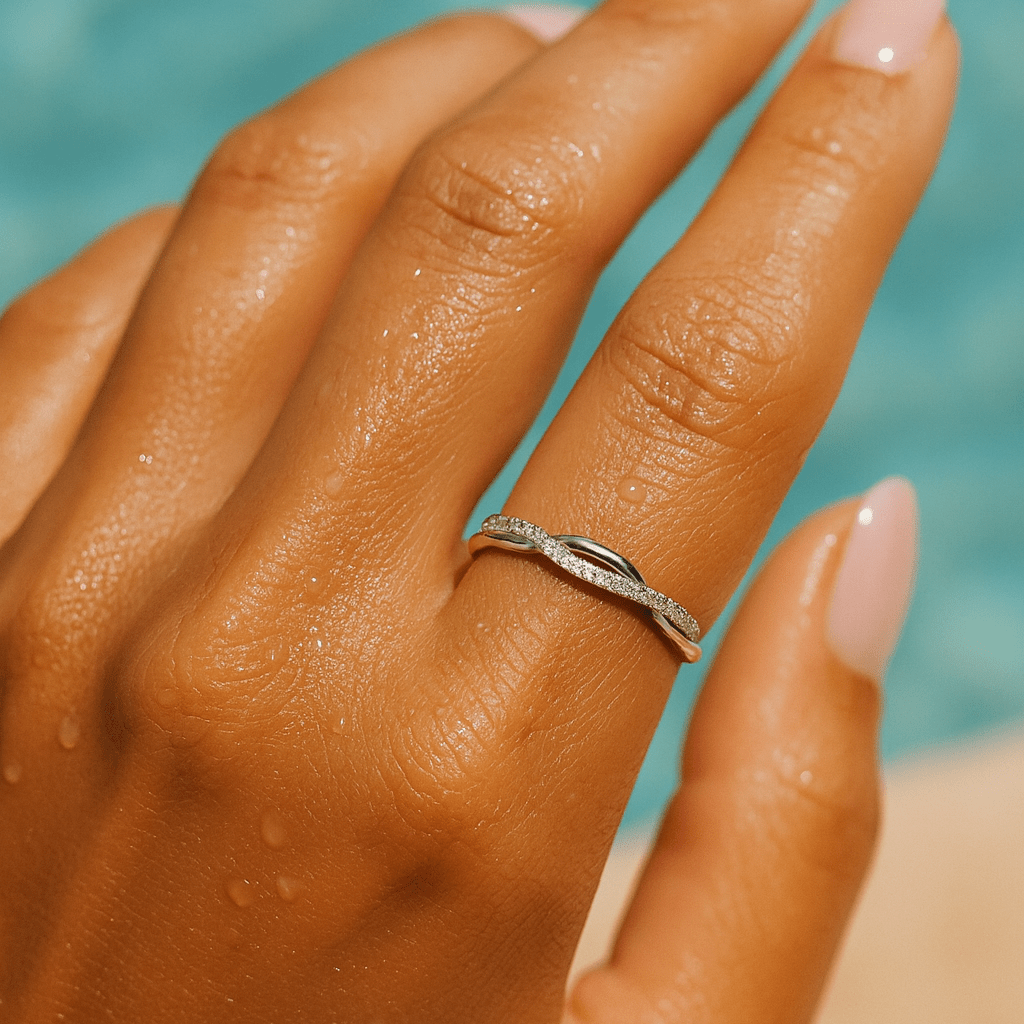Close-up of Silver Twist Ring – sterling silver twisted band featuring sparkling moissanite stones, minimalist waterproof jewelry.