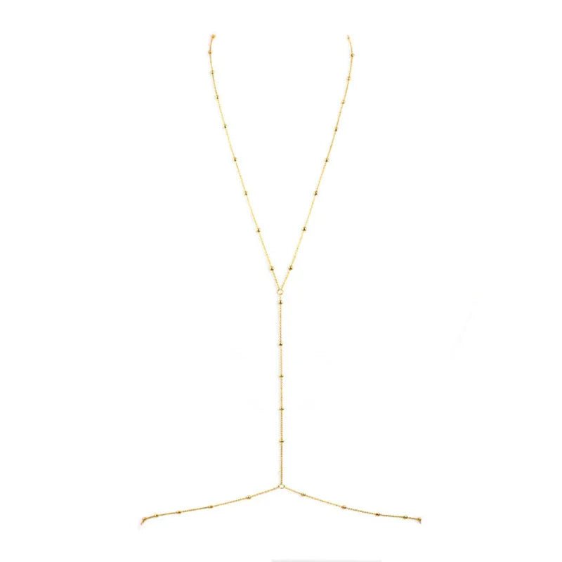 Close-up of gold minimalist waist chain detail – stainless steel beaded links around the belly